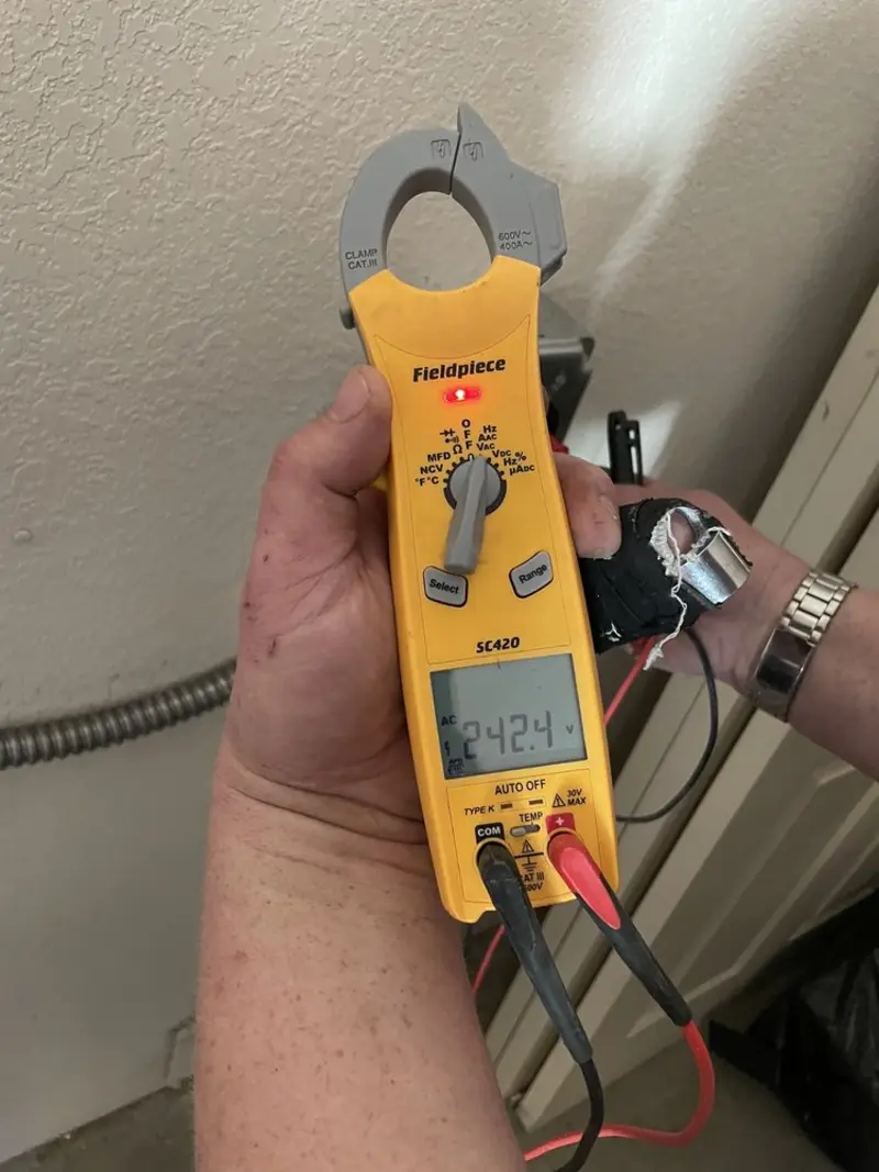 Voltage testing with clamp meter during Recessed Lighting Installation in Morrison